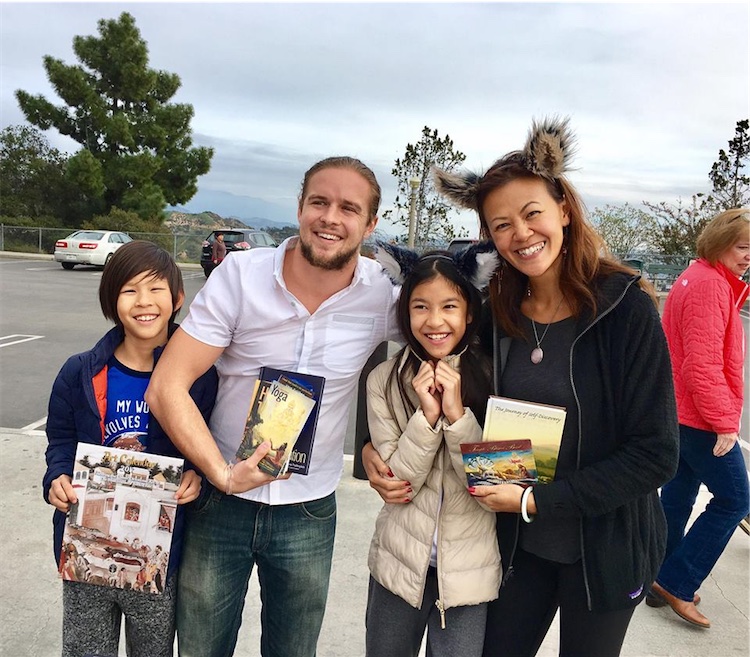 A happy Hong Kong family with their books