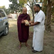 Famous Monk Sayadaw receiving Bhagavad Gita in Burmese by HG Lila Govinda prabhu