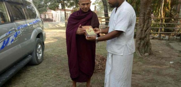 Famous Monk Sayadaw receiving Bhagavad Gita in Burmese by HG Lila Govinda prabhu