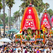 Distributing books at an exhibit at Ratha yatra in LA