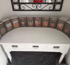 Pictures of Brendon and his set of books at his home